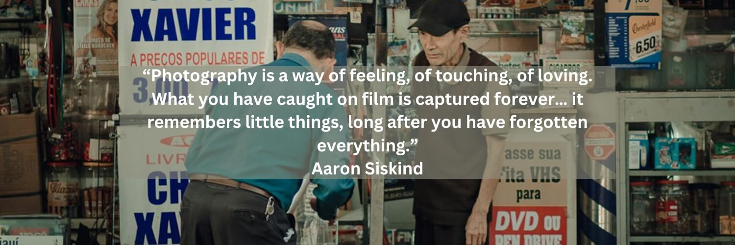A photo of two elderly men outside a storefront.